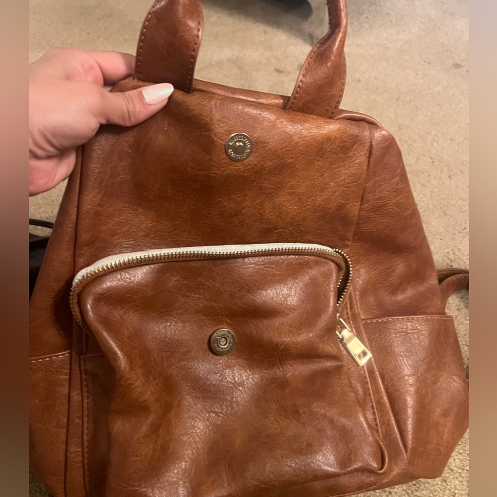 Lightly used brown pleather backpack